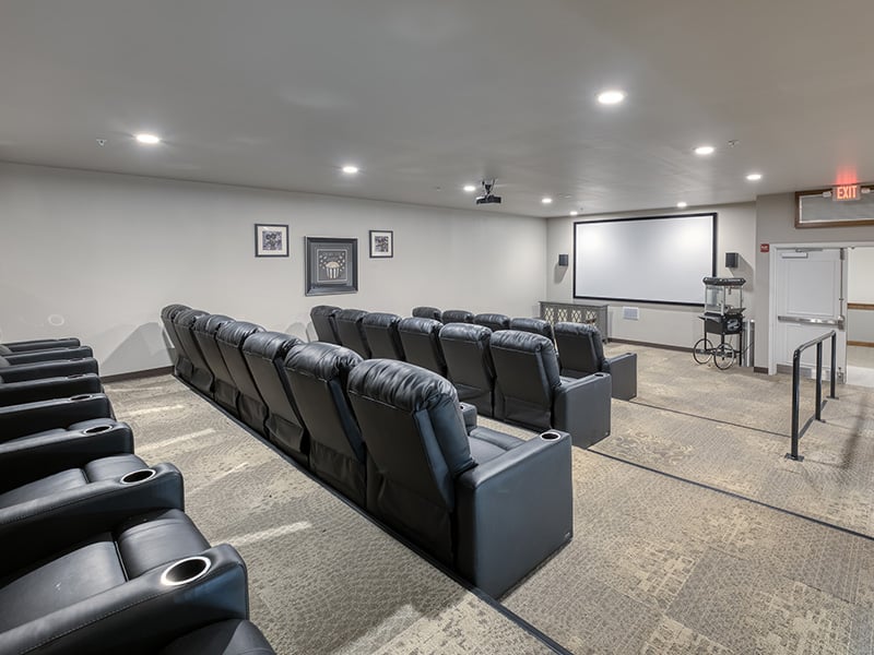 The comfortable and accessible movie theater at Cedarhurst of Naperville, providing easy-to-access entertainment for residents.