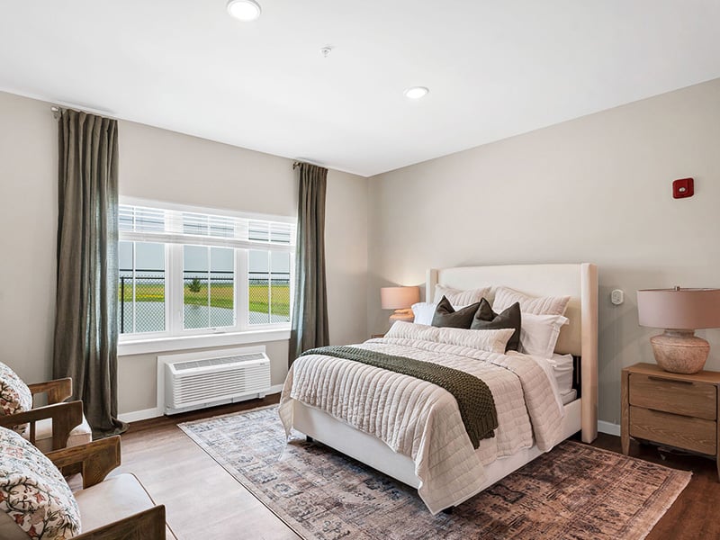Bedroom of a senior apartment at Cedarhurst of Newburgh, designed for resident comfort and personalization.