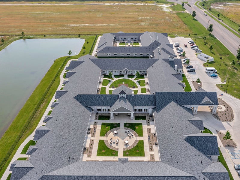 Aerial view of the entire Cedarhurst of Newburgh senior living community building and grounds.