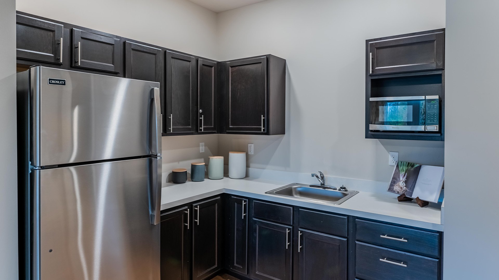 An accessible kitchenette in a senior apartment at Cedarhurst of Nicholasville, designed for ease of use and independence.