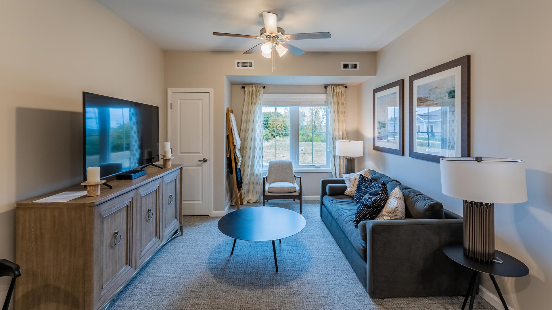 Senior-friendly apartment living room at Cedarhurst of Nicholasville, offering comfortable and accessible design for residents.