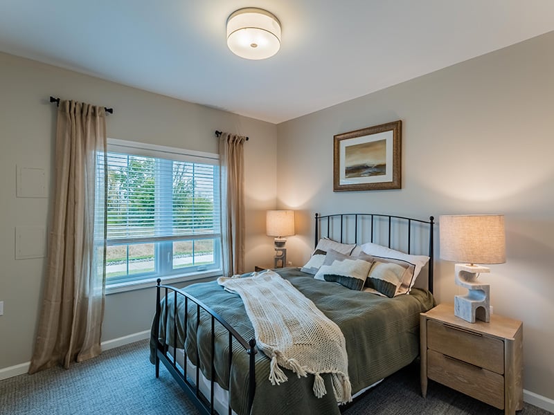 Bedroom of a senior apartment at Cedarhurst of Nicholasville, designed for resident comfort and personalization.