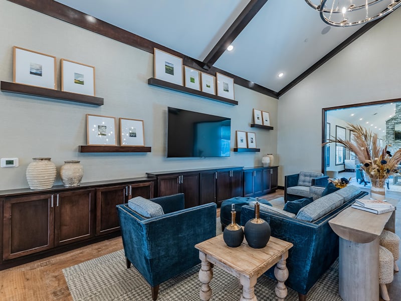 A welcoming common area at Cedarhurst of Nicholasville, featuring ample seating and a television, perfect for relaxation or watching programs
