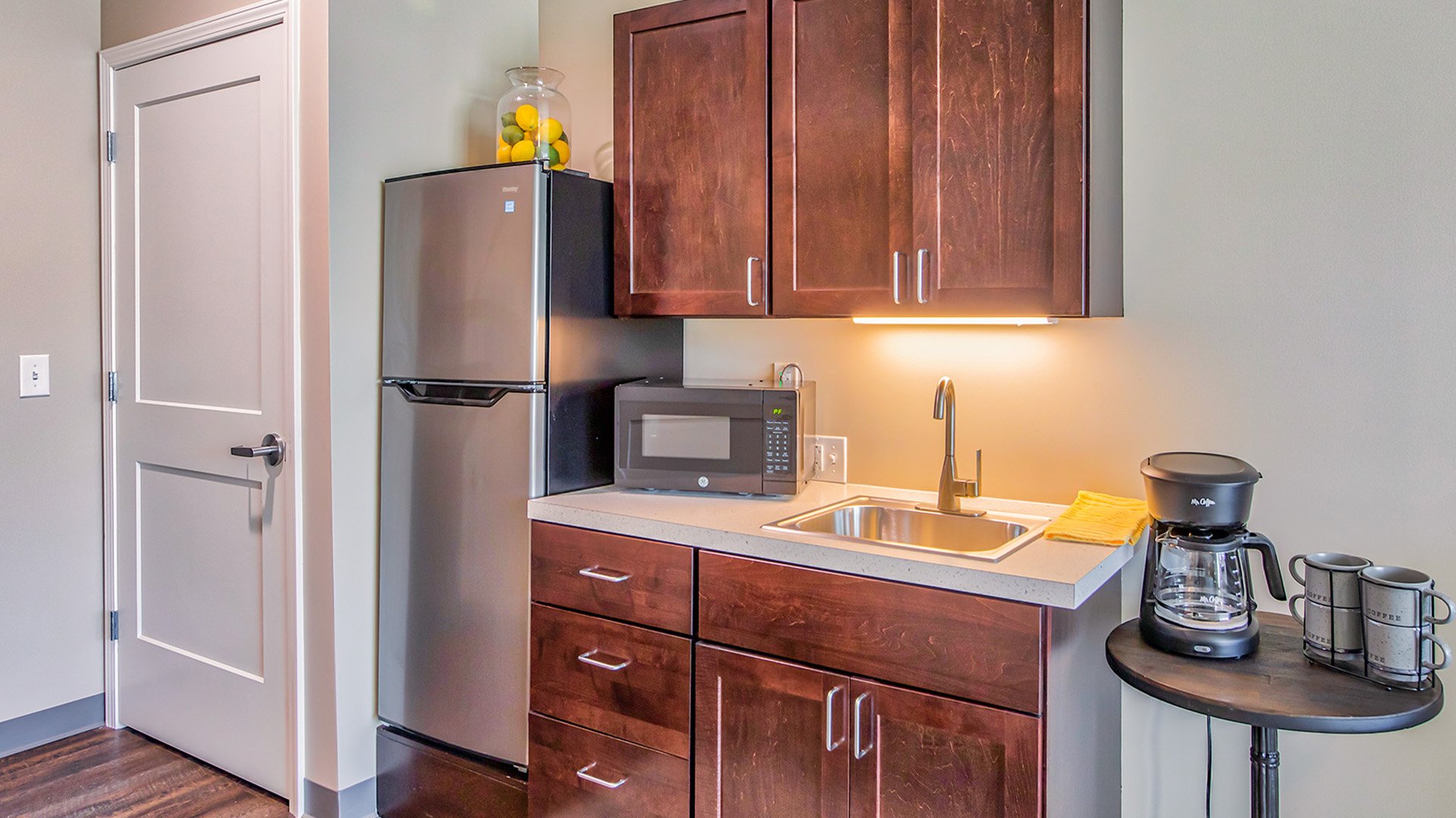 An accessible kitchenette in a senior apartment at Cedarhurst of O'Fallon, designed for ease of use and independence