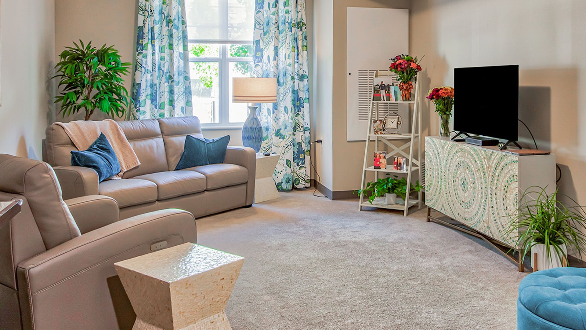 Senior-friendly apartment living room at Cedarhurst of O'Fallon, offering comfortable and accessible design for residents