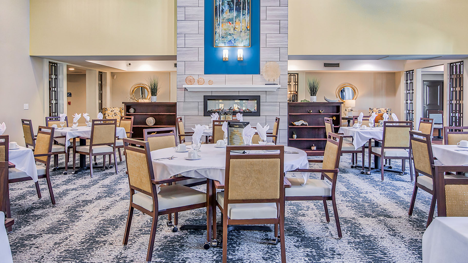 A spacious and bright dining room at Cedarhurst of O'Fallon, offering comfortable seating for meals