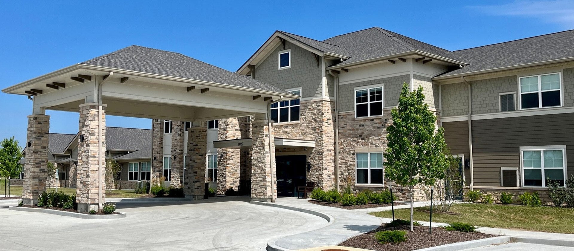 The welcoming front exterior of Cedarhurst of O'Fallon senior living community