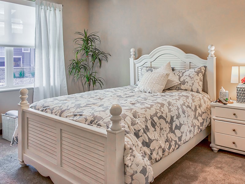 Bedroom of a senior apartment at Cedarhurst of O'Fallon, designed for resident comfort and personalization