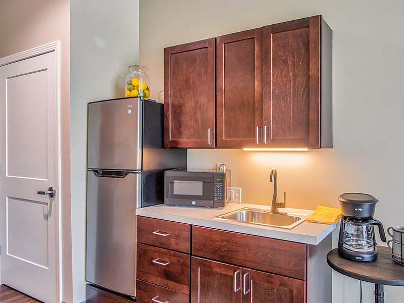 An accessible kitchenette in a senior apartment at Cedarhurst of O'Fallon, designed for ease of use and independence