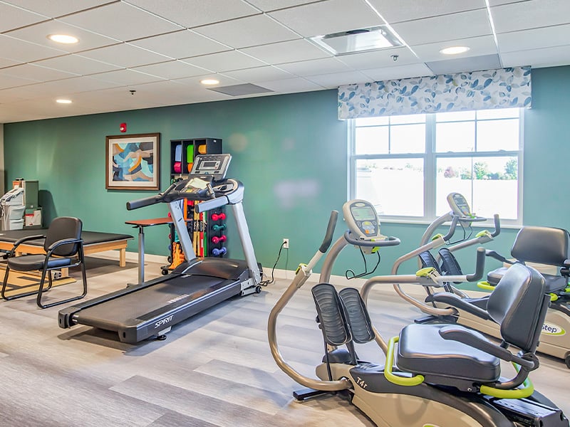 The dedicated physical therapy room at Cedarhurst of O'Fallon, equipped with accessible equipment for resident rehabilitation and wellness