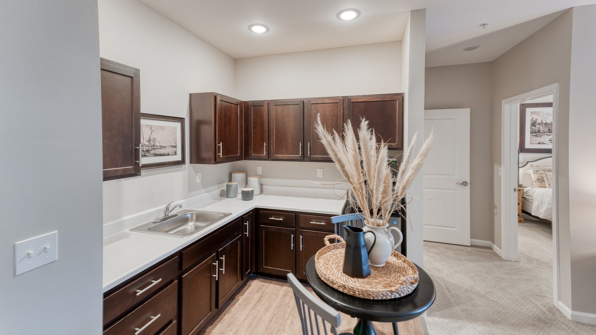 An accessible kitchenette in a senior apartment at Cedarhurst of Owensboro, designed for ease of use and independence.
