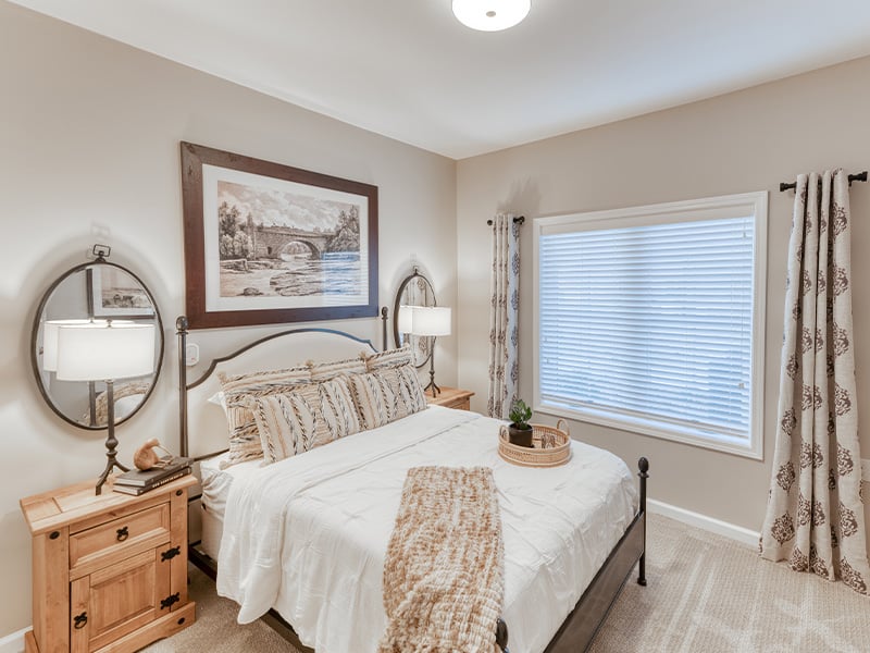 Bedroom of a senior apartment at Cedarhurst of Owensboro, designed for resident comfort and personalization.
