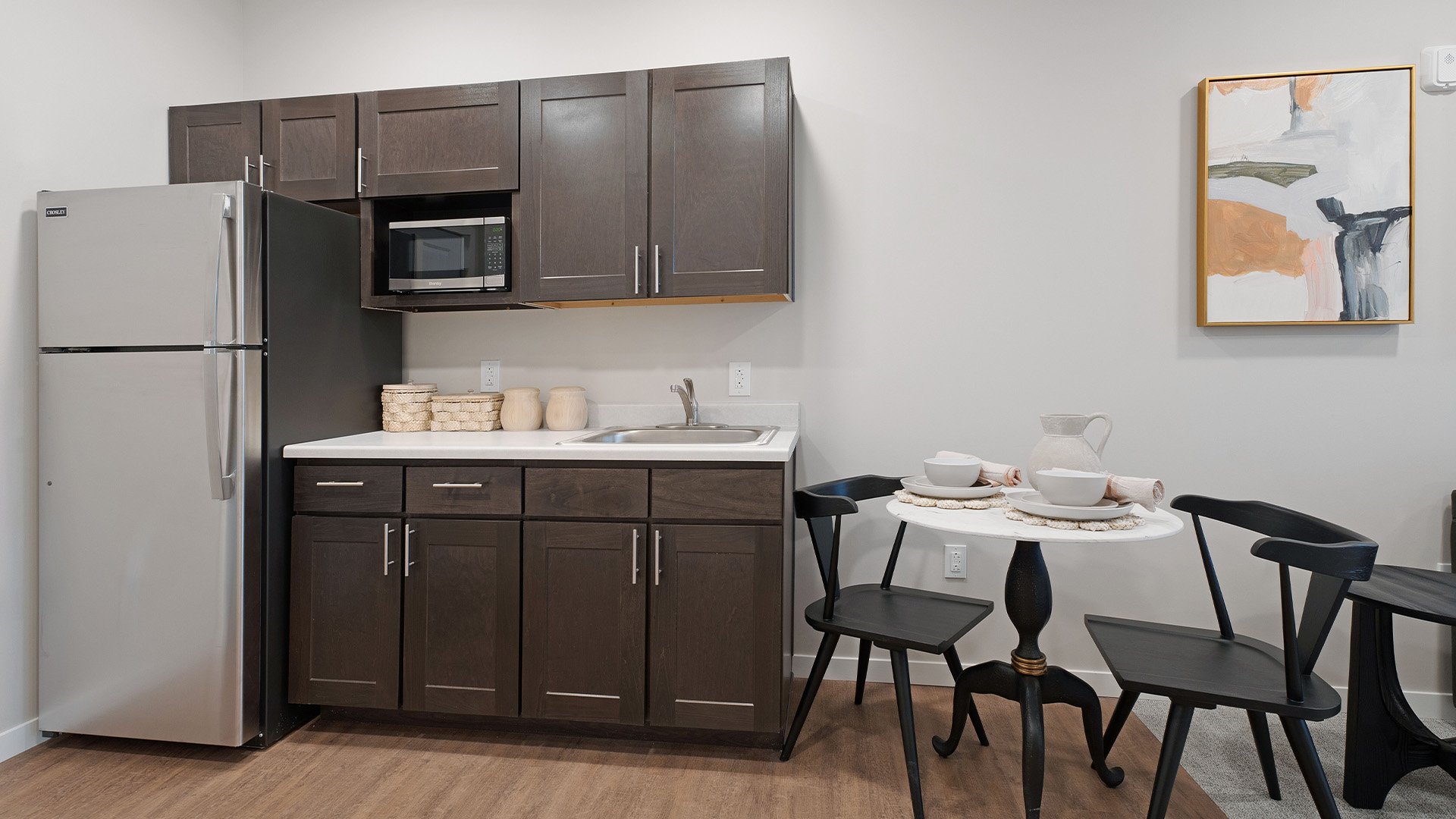 An accessible kitchenette in a senior apartment at Cedarhurst of Salina, designed for ease of use and independence