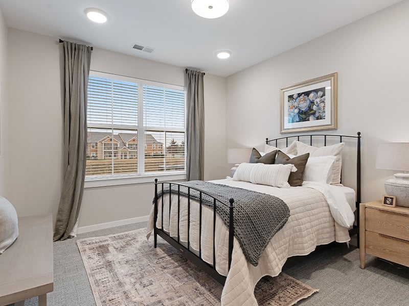 Cedarhurst of Salina: A cozy and well-appointed senior apartment bedroom for residents