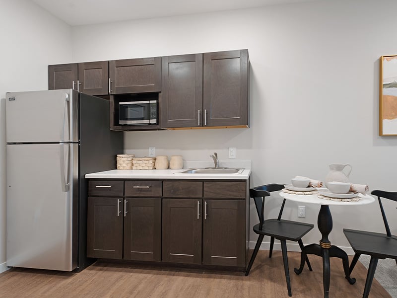 An accessible kitchenette in a senior apartment at Cedarhurst of Salina, designed for ease of use and independence