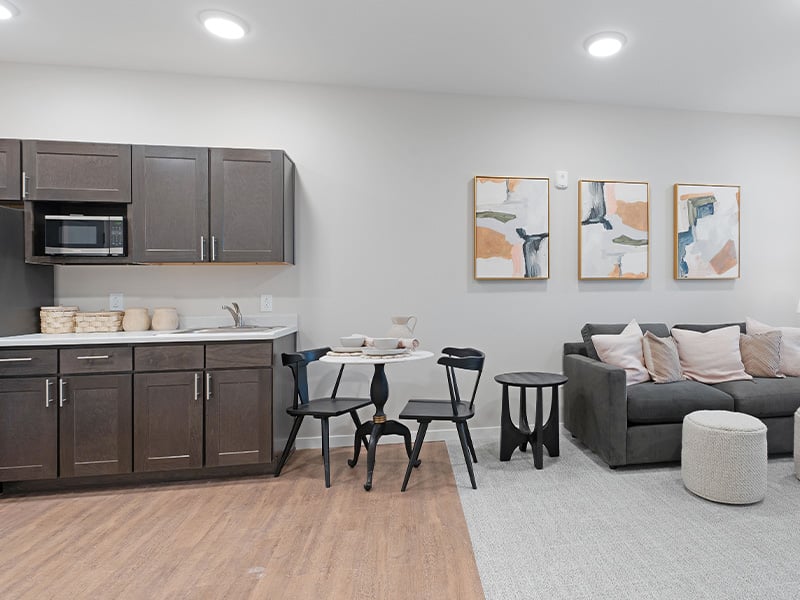 Senior-friendly apartment living room at Cedarhurst of Salina, offering comfortable and accessible design for residents