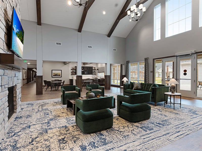 Cedarhurst of Salina's cozy common area, complete with a warm fireplace and comfortable seating