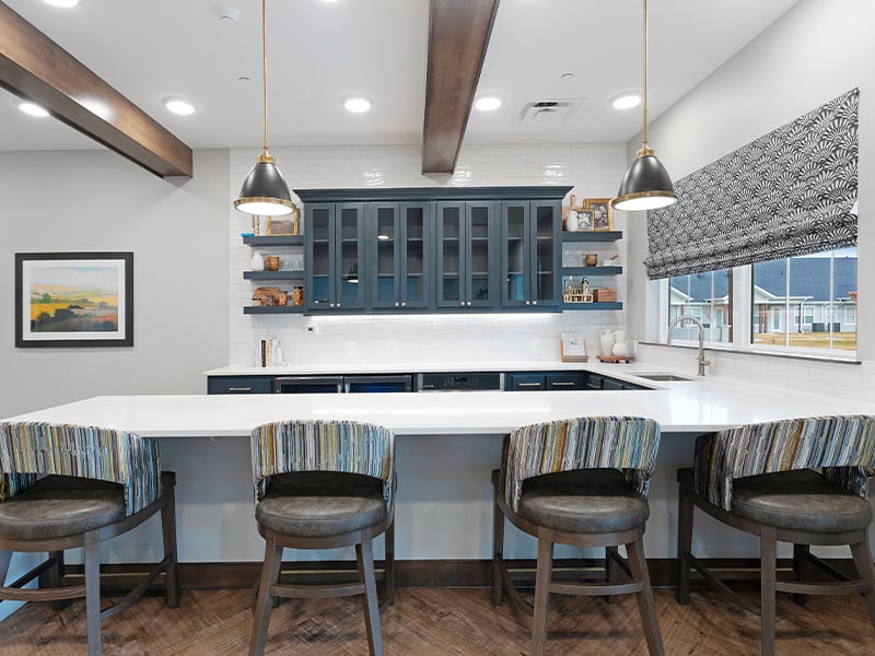 Senior-accessible community kitchen and dining space at Cedarhurst of Salina offering ample seating—perfect for dining and gathering