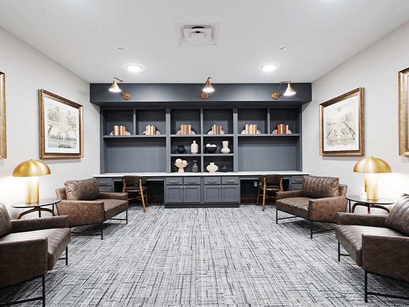 A welcoming, senior-friendly library at Cedarhurst of Salina with accessible resources for reading and relaxation