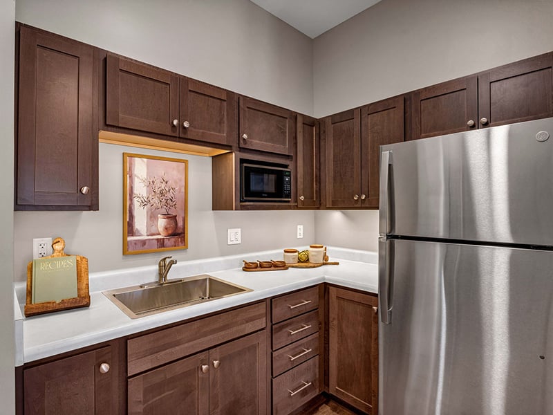An accessible kitchenette in a senior apartment at Cedarhurst of Shawnee, designed for ease of use and independence