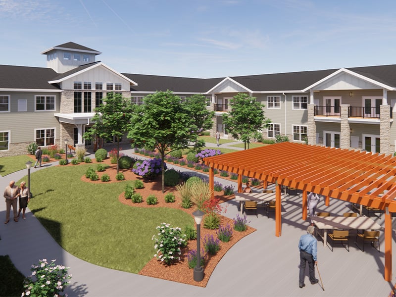 Outdoor green space at Cedarhurst of Shawnee with paved walking paths, a wooden pergola, and fireplace