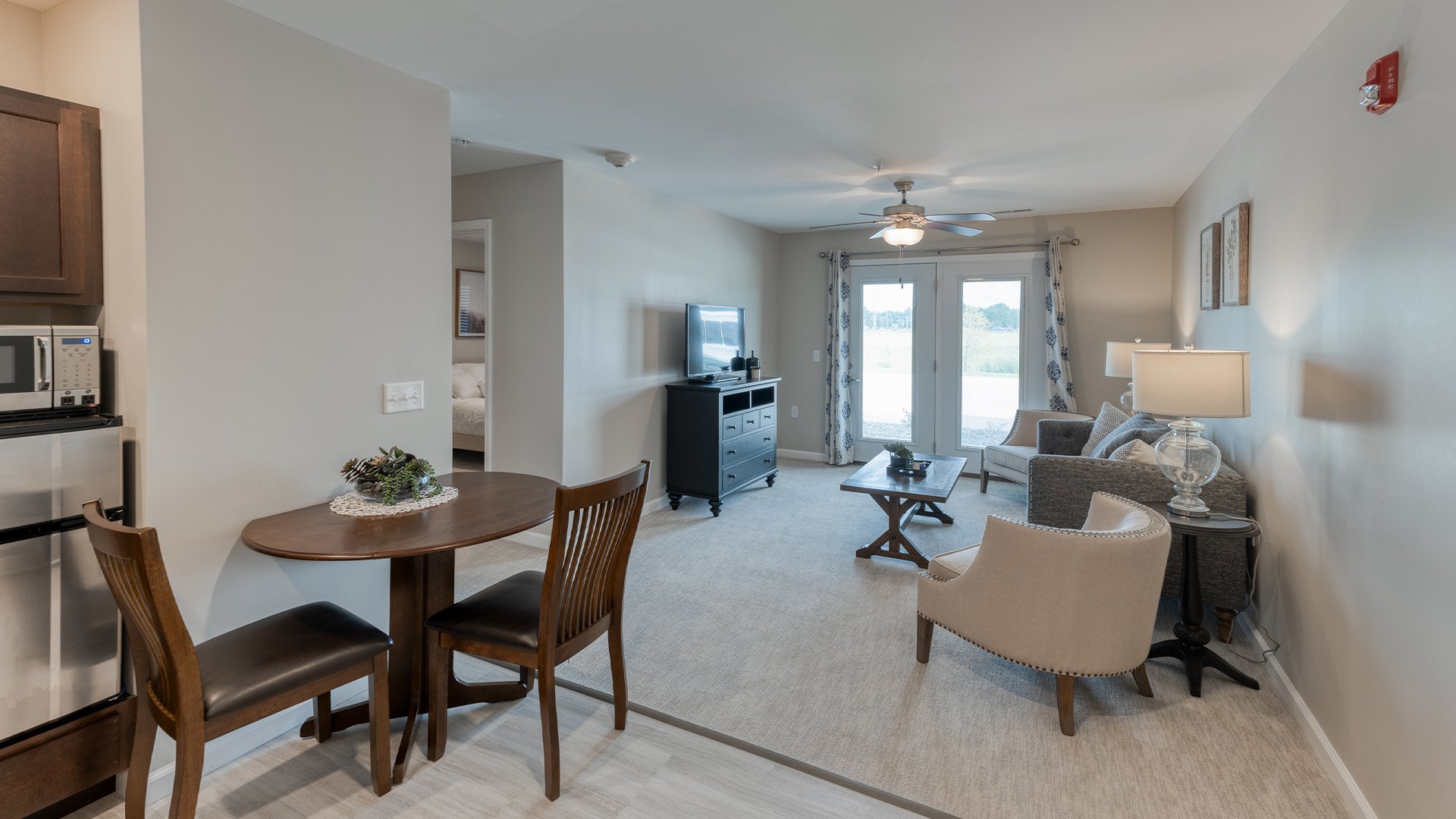 Senior-friendly apartment living room at Cedarhurst of Springfield, IL, offering comfortable and accessible design for residents