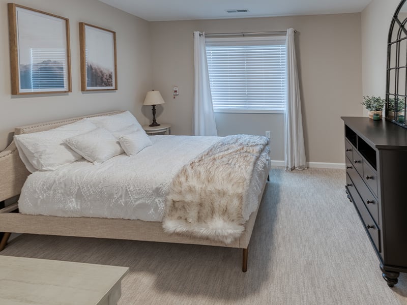 Bedroom of a senior apartment at Cedarhurst of Springfield, IL, designed for resident comfort and personalization
