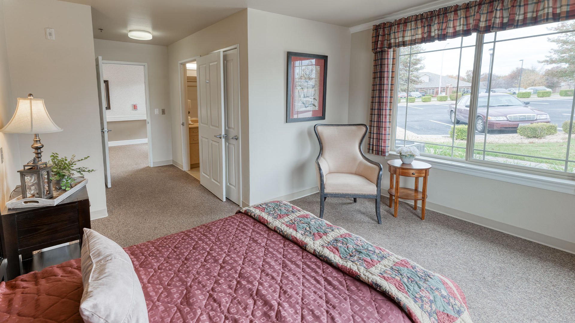 Senior-friendly apartment living room at Cedarhurst of Springfield, MO, offering comfortable and accessible design for residents