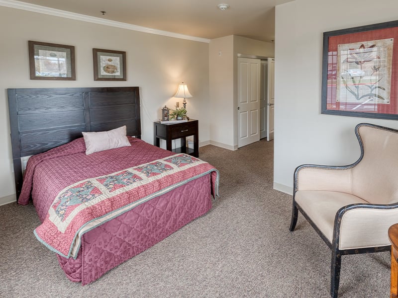 Bedroom of a senior apartment at Cedarhurst of Springfield, MO, designed for resident comfort and personalization