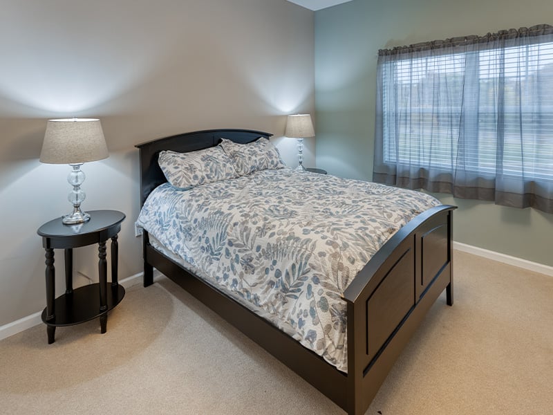 Bedroom of a senior apartment at Cedarhurst of St. Charles, designed for resident comfort and personalization