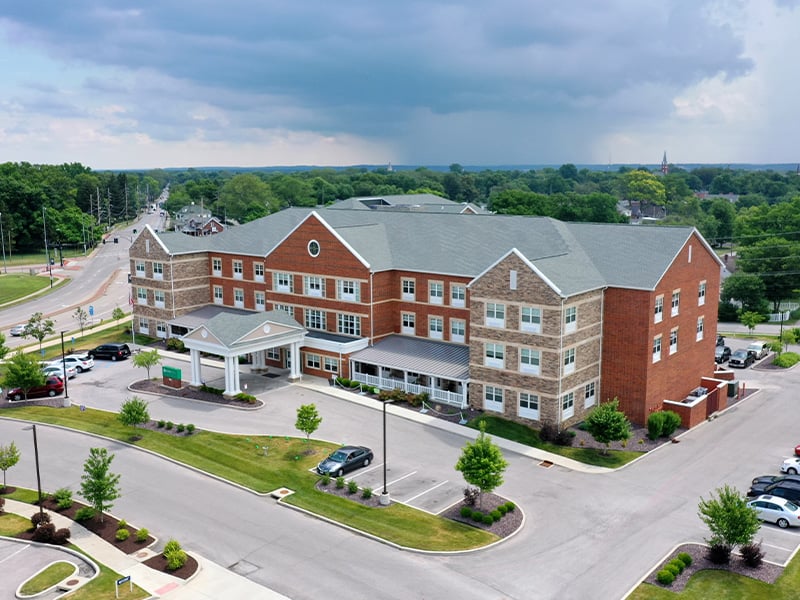 Aerial view of the entire Cedarhurst of St. Charles senior living community building and grounds