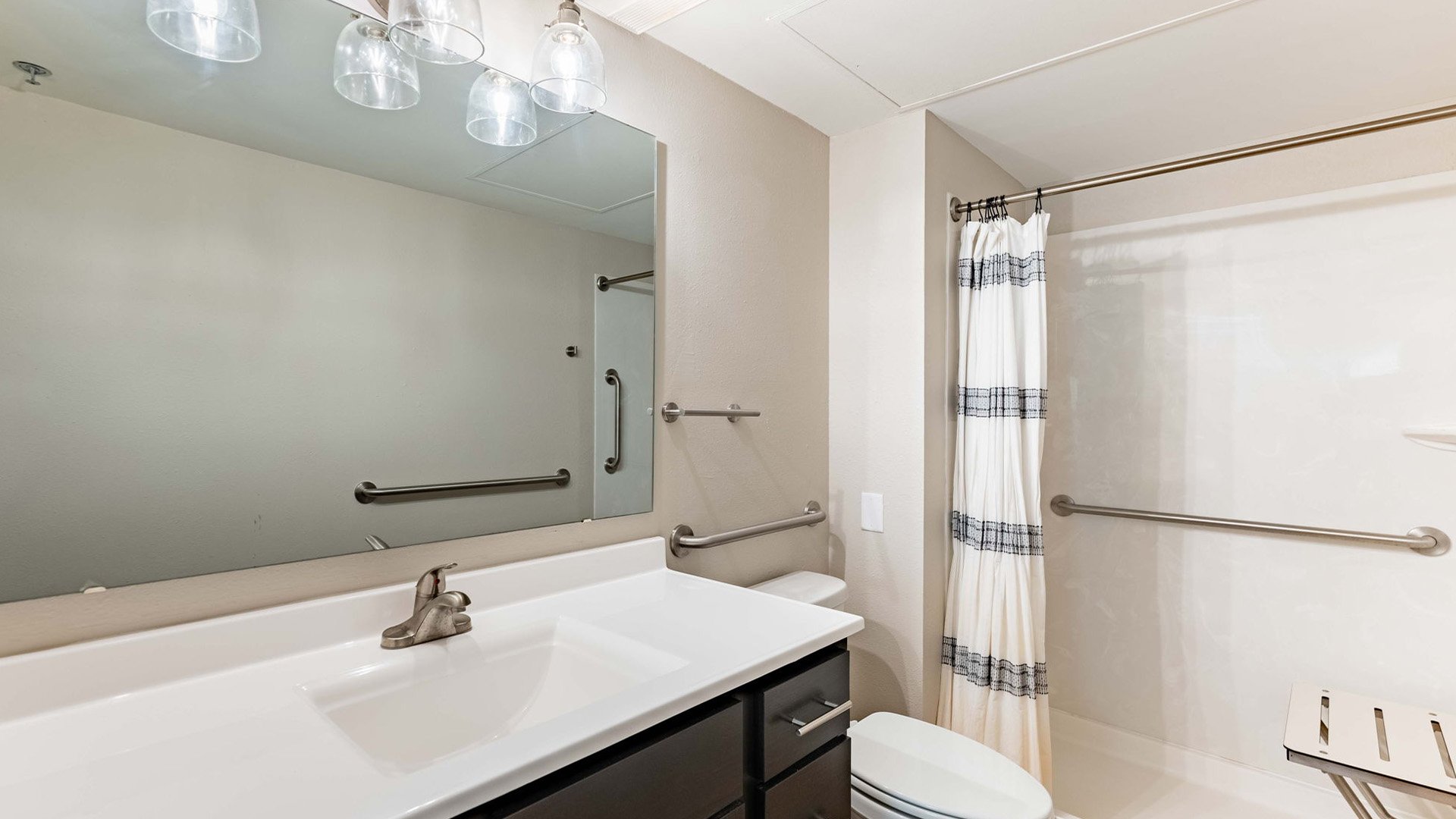 Bathroom of a senior apartment at Cedarhurst of Tesson Heights, built with accessibility features to support residents