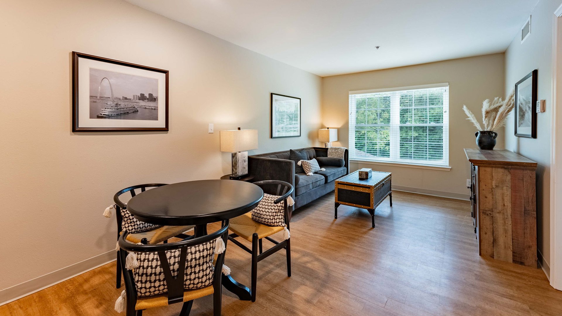 Senior-friendly apartment living room at Cedarhurst of Tesson Heights, offering comfortable and accessible design for residents
