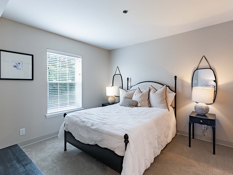 Cedarhurst of Tesson Heights: A cozy and well-appointed senior apartment bedroom for residents