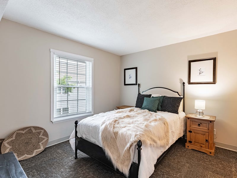 Bedroom of a senior apartment at Cedarhurst of Tesson Heights, designed for resident comfort and personalization