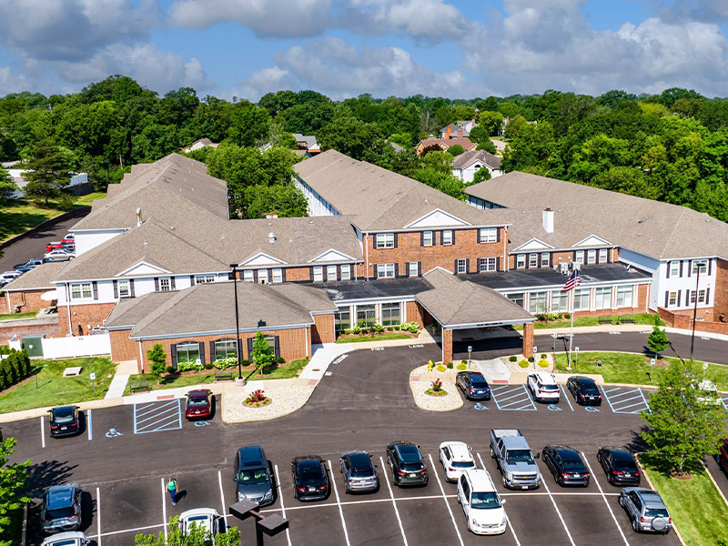 Aerial view of the entire Cedarhurst of Tesson Heights senior living community building and grounds
