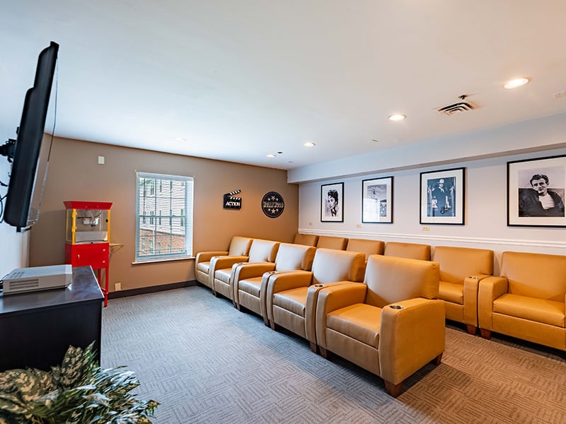The comfortable and accessible movie theater at Cedarhurst of Tesson Heights, providing easy-to-access entertainment for residents