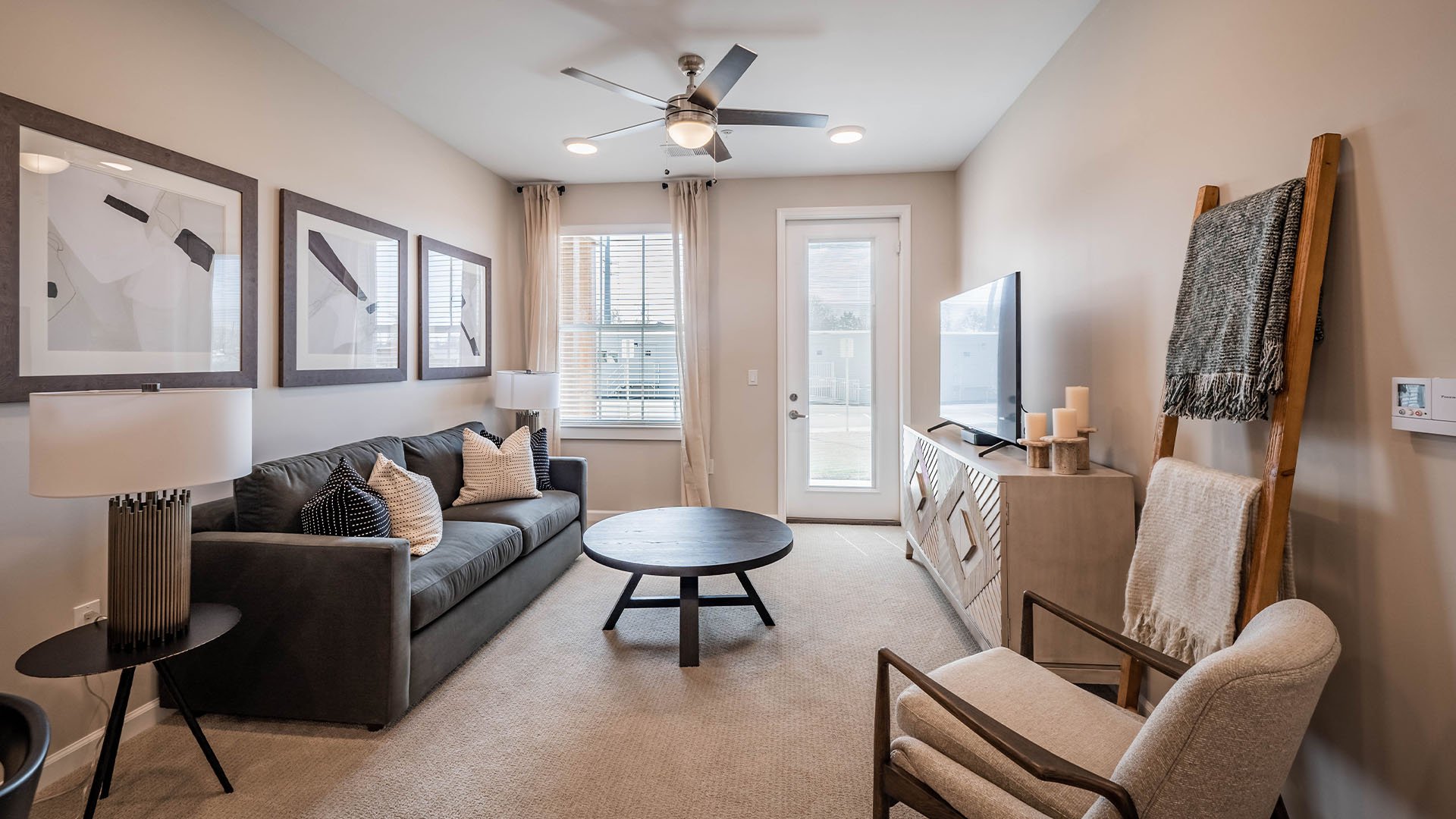 Senior-friendly apartment living room at Cedarhurst of Topeka, offering comfortable and accessible design for residents