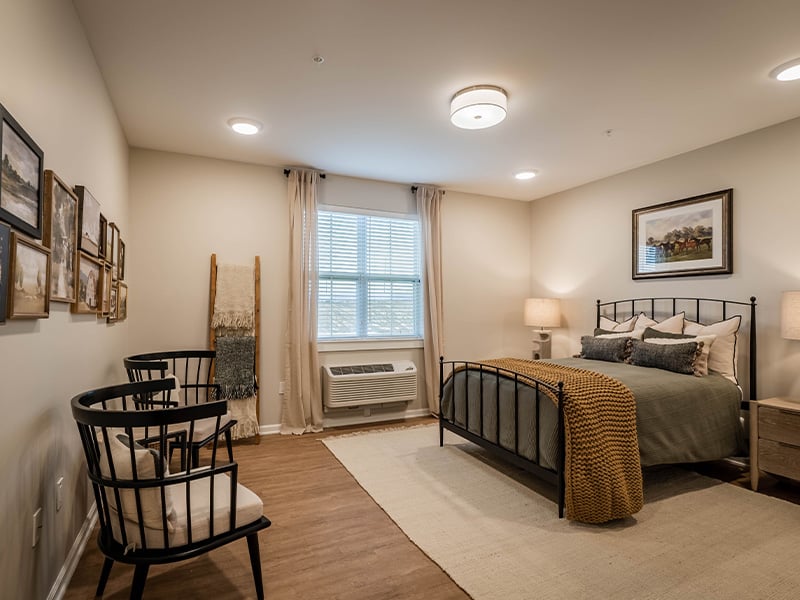 Bedroom of a senior apartment at Cedarhurst of Topeka, designed for resident comfort and personalization