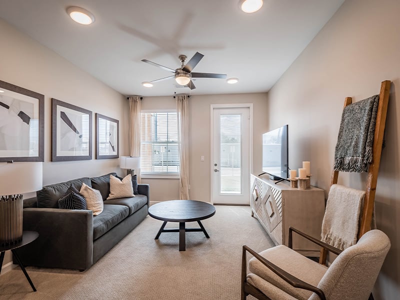 Senior-friendly apartment living room at Cedarhurst of Topeka, offering comfortable and accessible design for residents