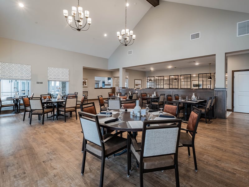 A community dining room at Cedarhurst of Topeka, providing convenient all-day dining for residents