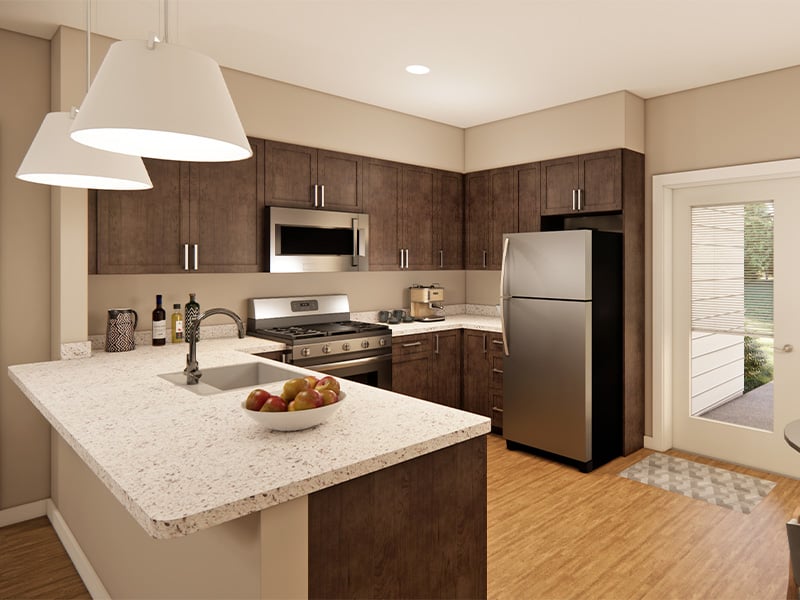 A full kitchen with island inside of Cedarhurst of Topeka's Independent Living at Cedarhurst Cottages