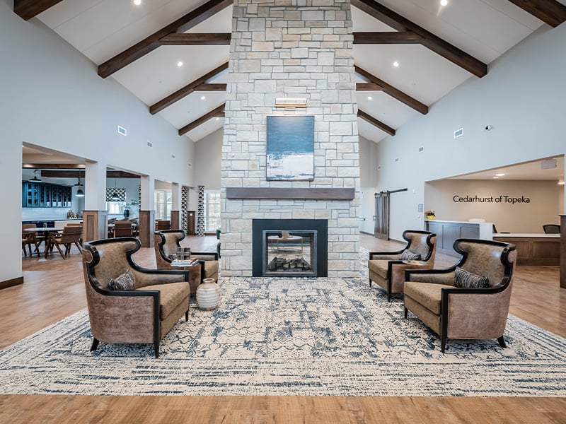 The bright and accessible main lobby at Cedarhurst of Topeka, offering a warm first impression to the senior living community