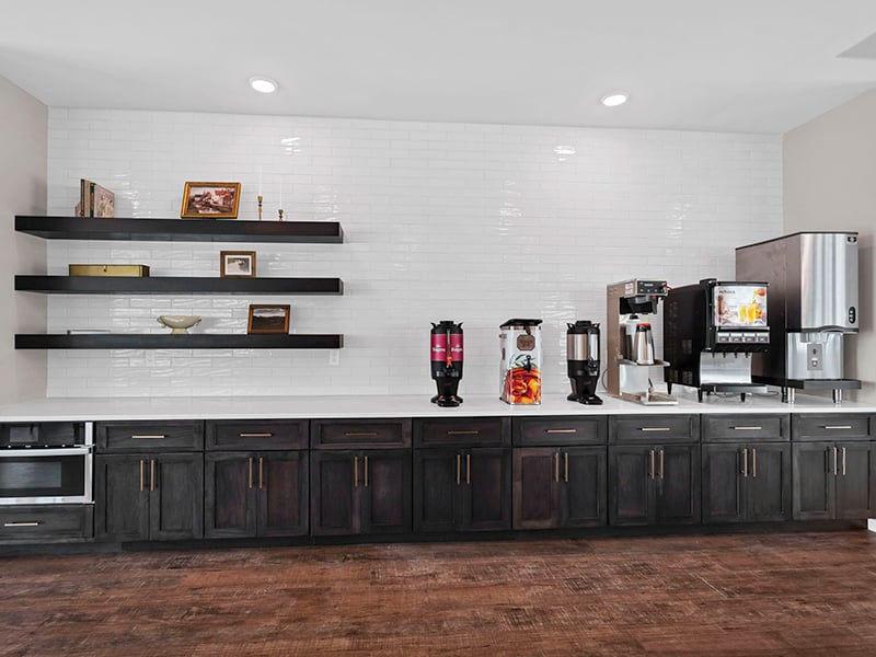 Clubhouse breakfast nook with a coffee station at Cedarhurst of Topeka's Independent Living at Cedarhurst Cottages