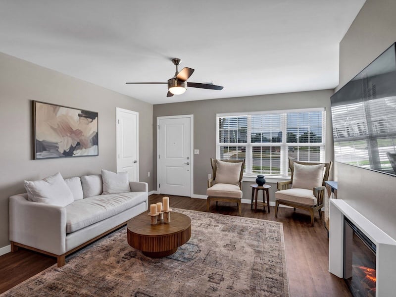 Senior-friendly living room and accessible kitchen at Cedarhurst of Topeka's Independent Living at Cedarhurst Cottages