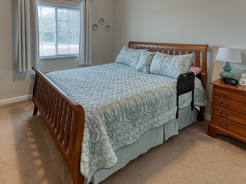 Bedroom of a senior apartment at Cedarhurst of Waterloo, designed for resident comfort and personalization
