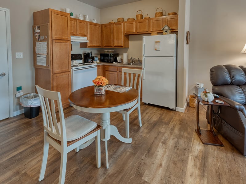 An accessible kitchenette in a senior apartment at Cedarhurst of Waterloo, designed for ease of use and independence