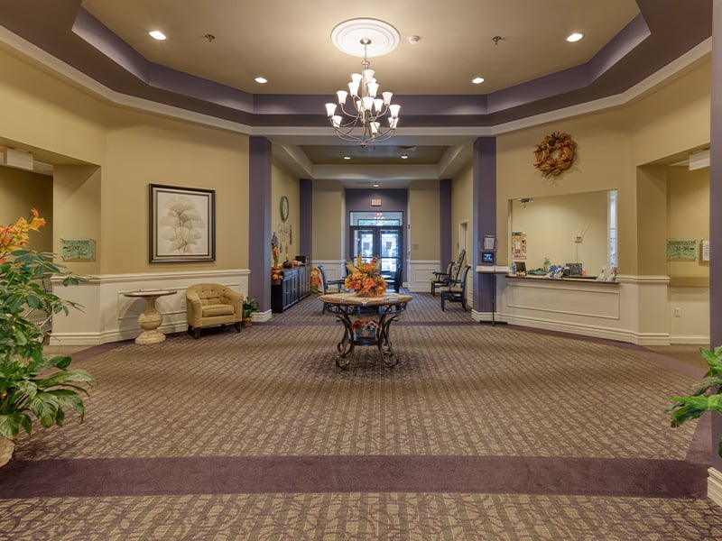 The bright and accessible main lobby at Cedarhurst of Waterloo, offering a warm first impression to the senior living community.