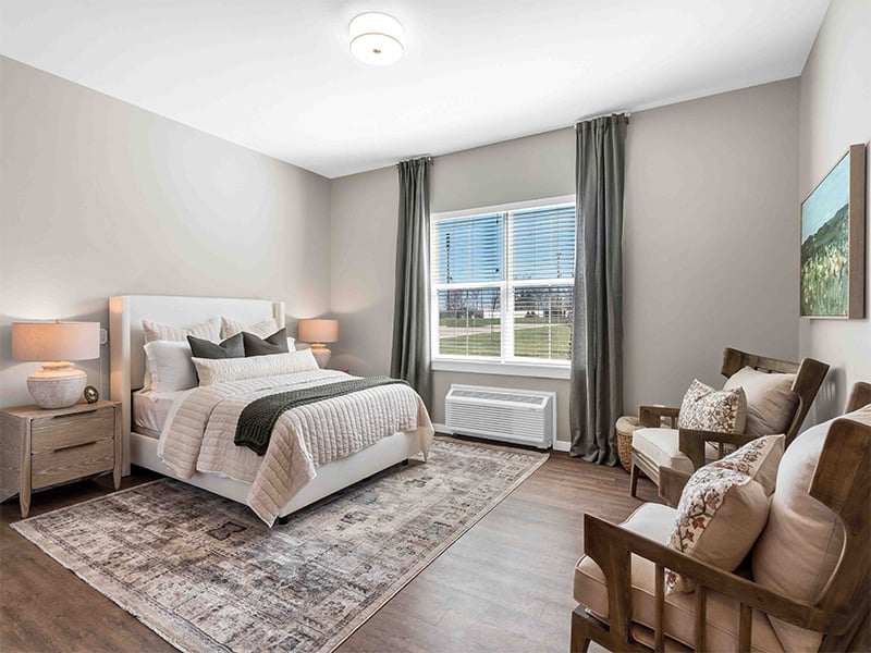 Bedroom of a senior apartment at Cedarhurst of Wentzville, designed for comfort and personalization