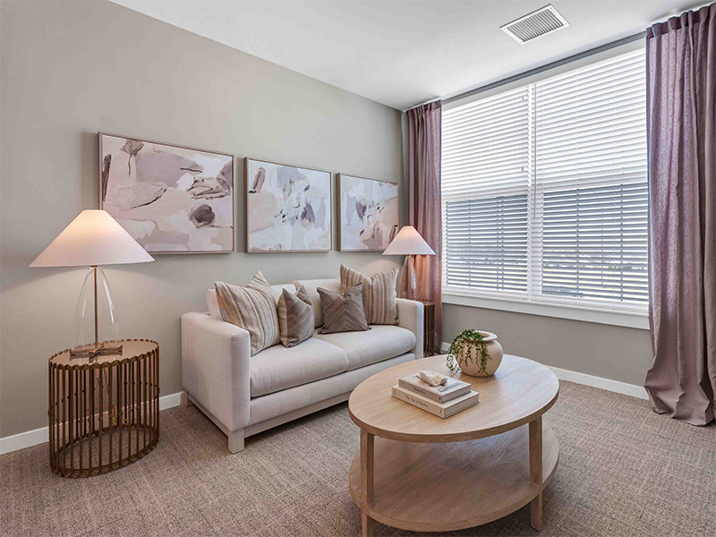 A spacious and bright living room inside a senior apartment at Cedarhurst of Wentzville